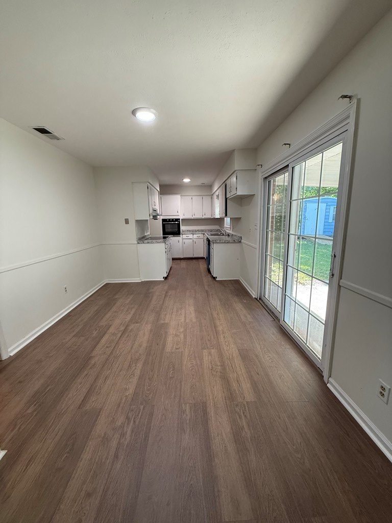 4355 Byron Street Columbus, GA 31907 - Photo 5 of 20 a view of a kitchen with wooden floor and electronic appliances