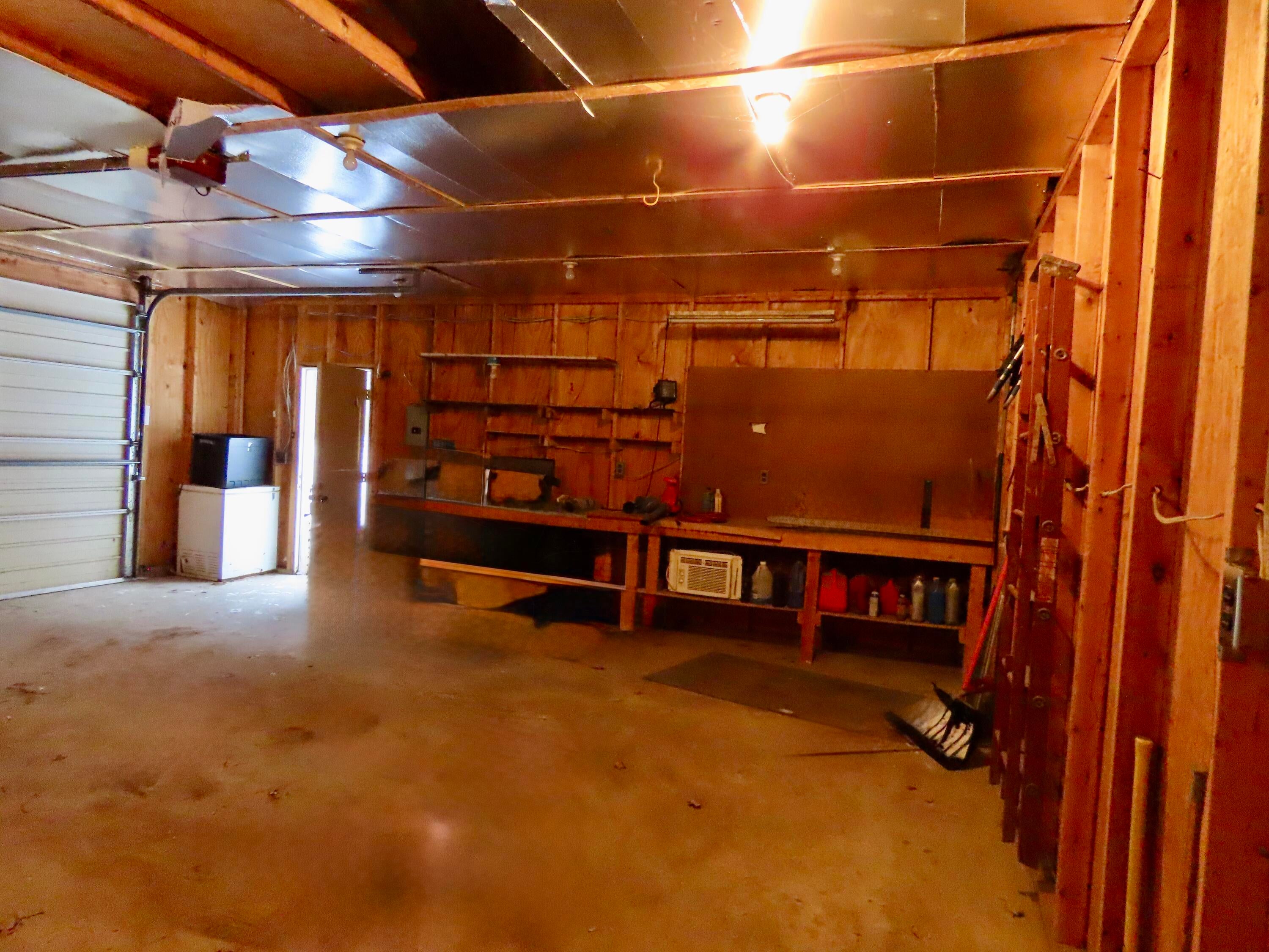 11595 Reimann Road Atlanta, MI 49709 - Photo 38 of 42 Workbench in garage