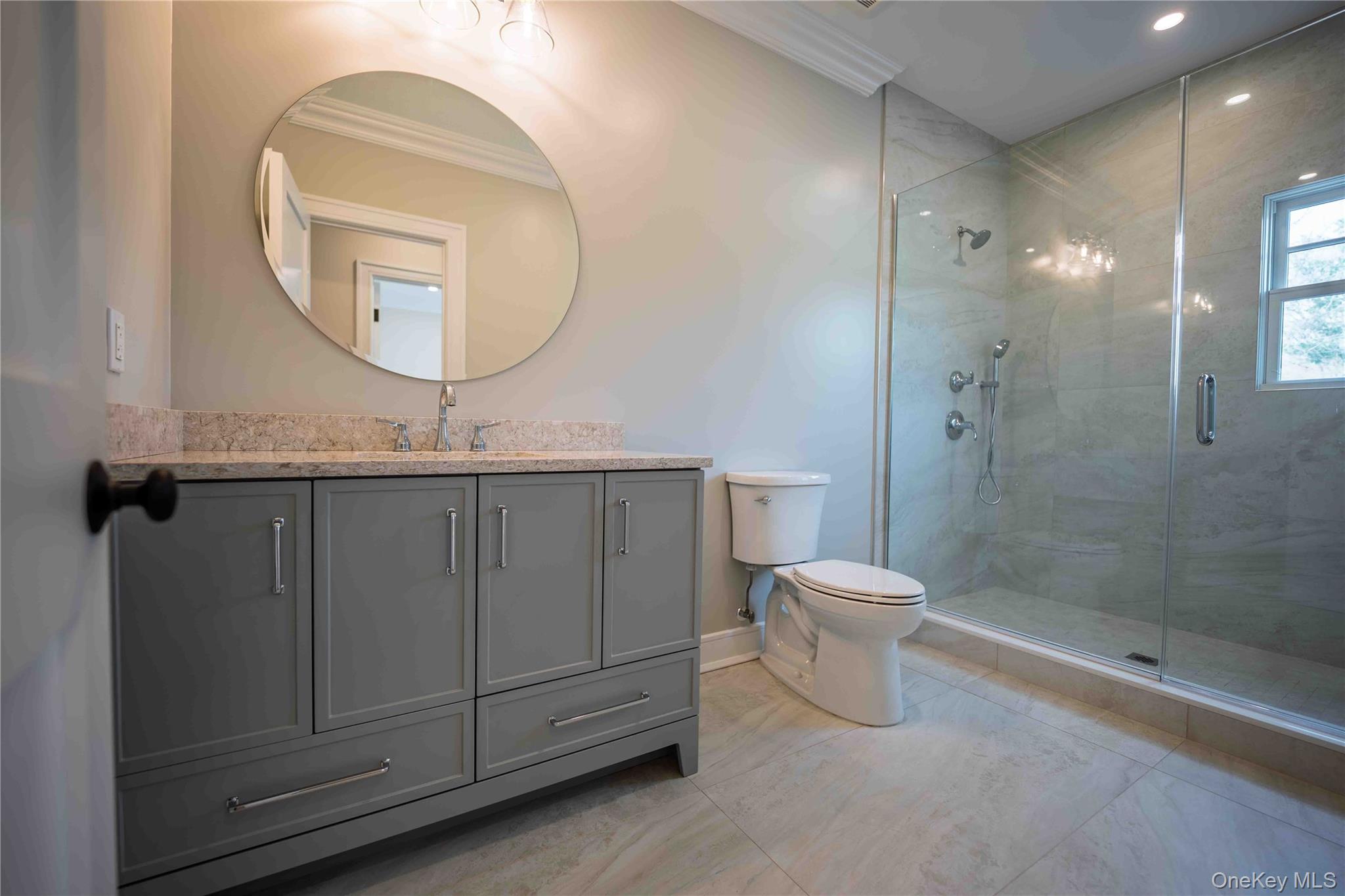 106 Cove Road Asharoken, NY 11768 - Photo 32 of 46 Full bathroom with vanity, a stall shower, and ornamental molding