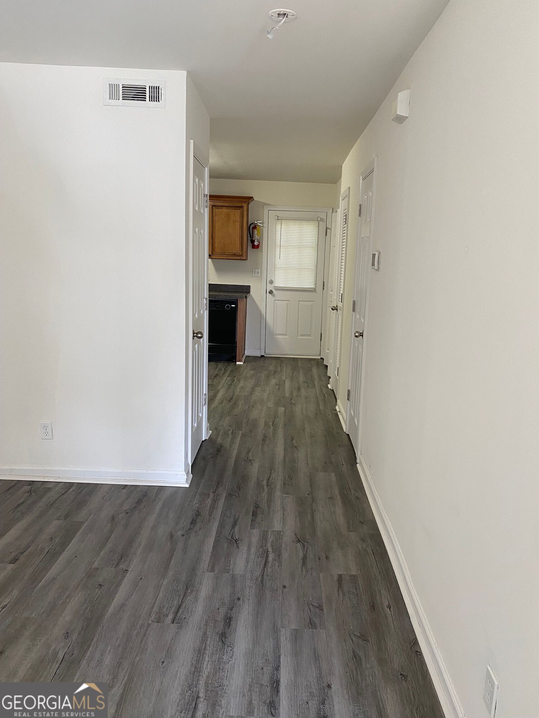 432 WI Parkway Dallas, GA 30132 - Photo 4 of 8 a view of empty room with wooden floor