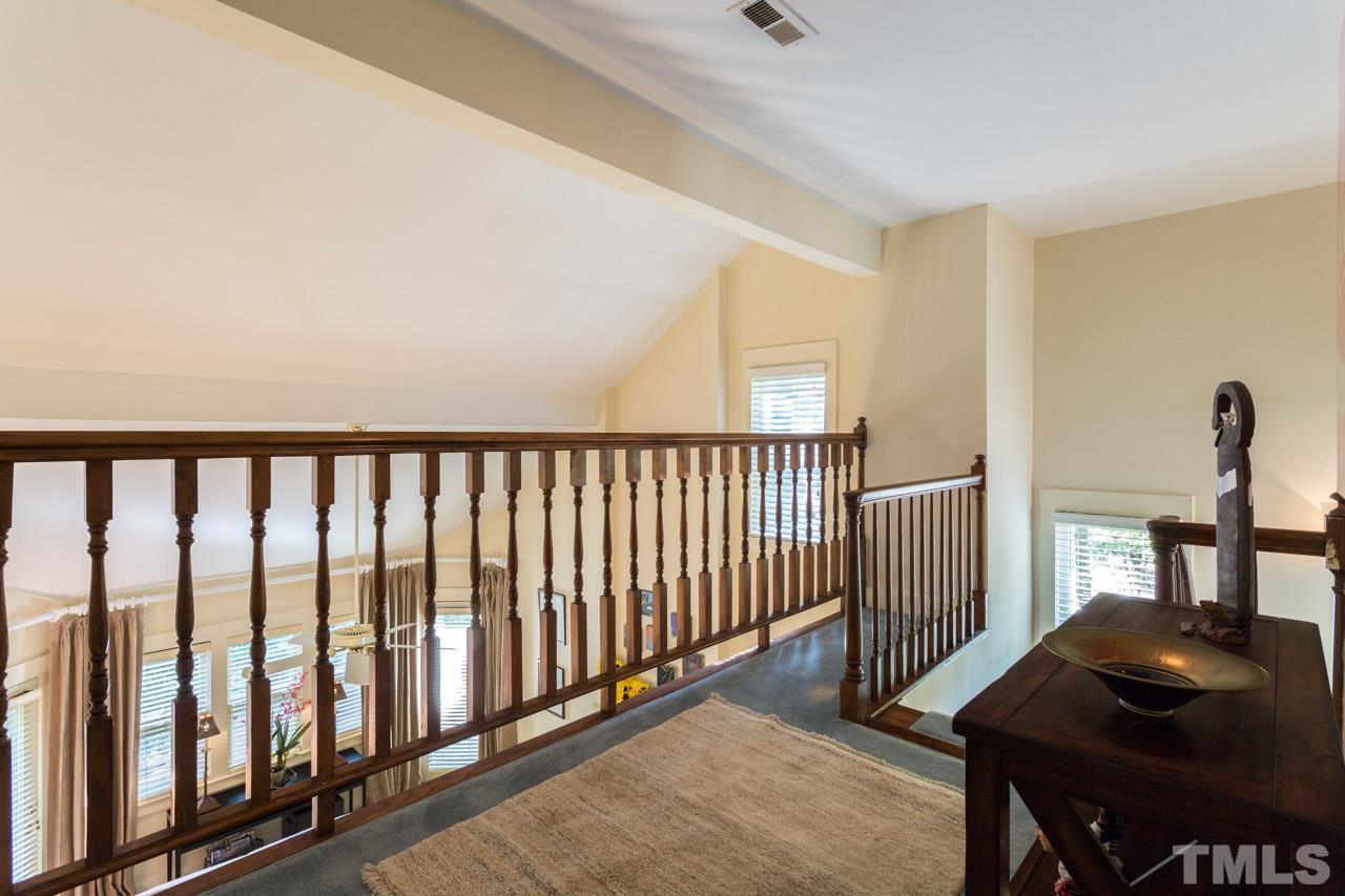 1723 Falls Church Road Raleigh, NC 27609 - Photo 18 of 25 Has high rail and looks over the vaulted living room