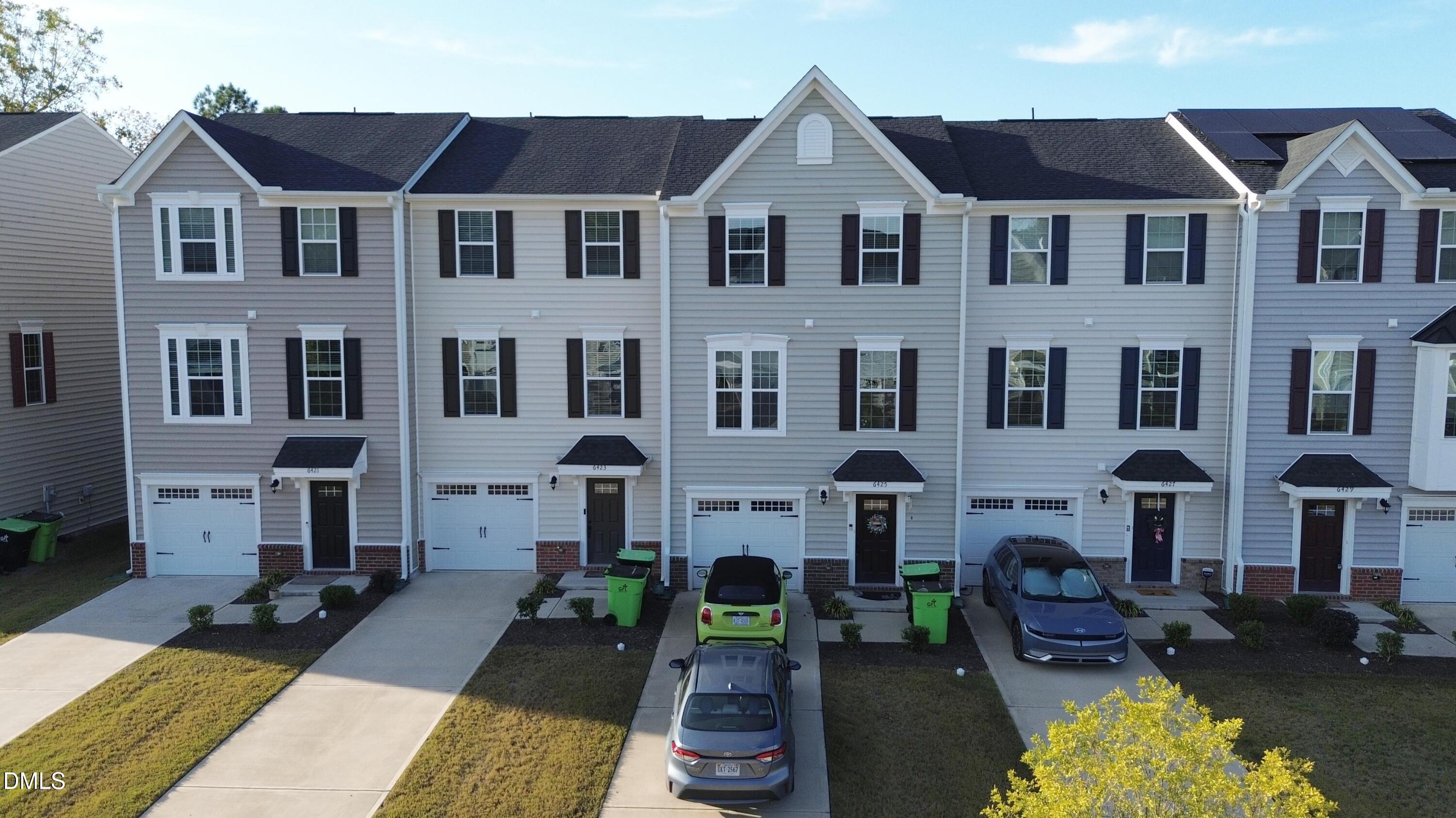 a view of a big house with a patio