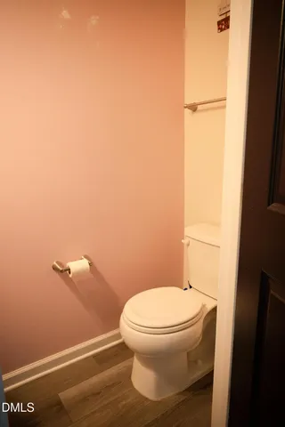 a kitchen with stainless steel appliances a sink a stove a microwave a refrigerator and cabinets