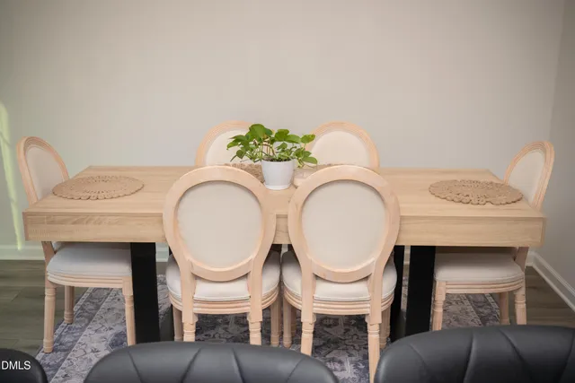 a white toilet sitting next to a shower curtain