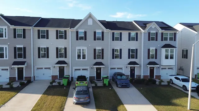 a front view of a building with many windows