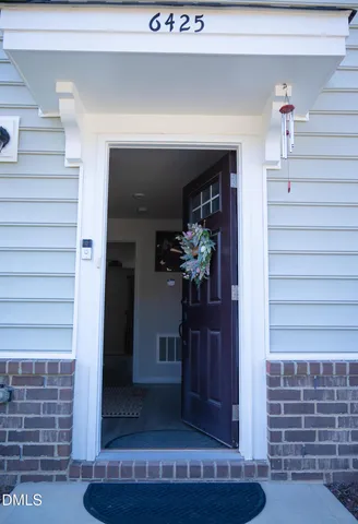 a view of a hallway with windows