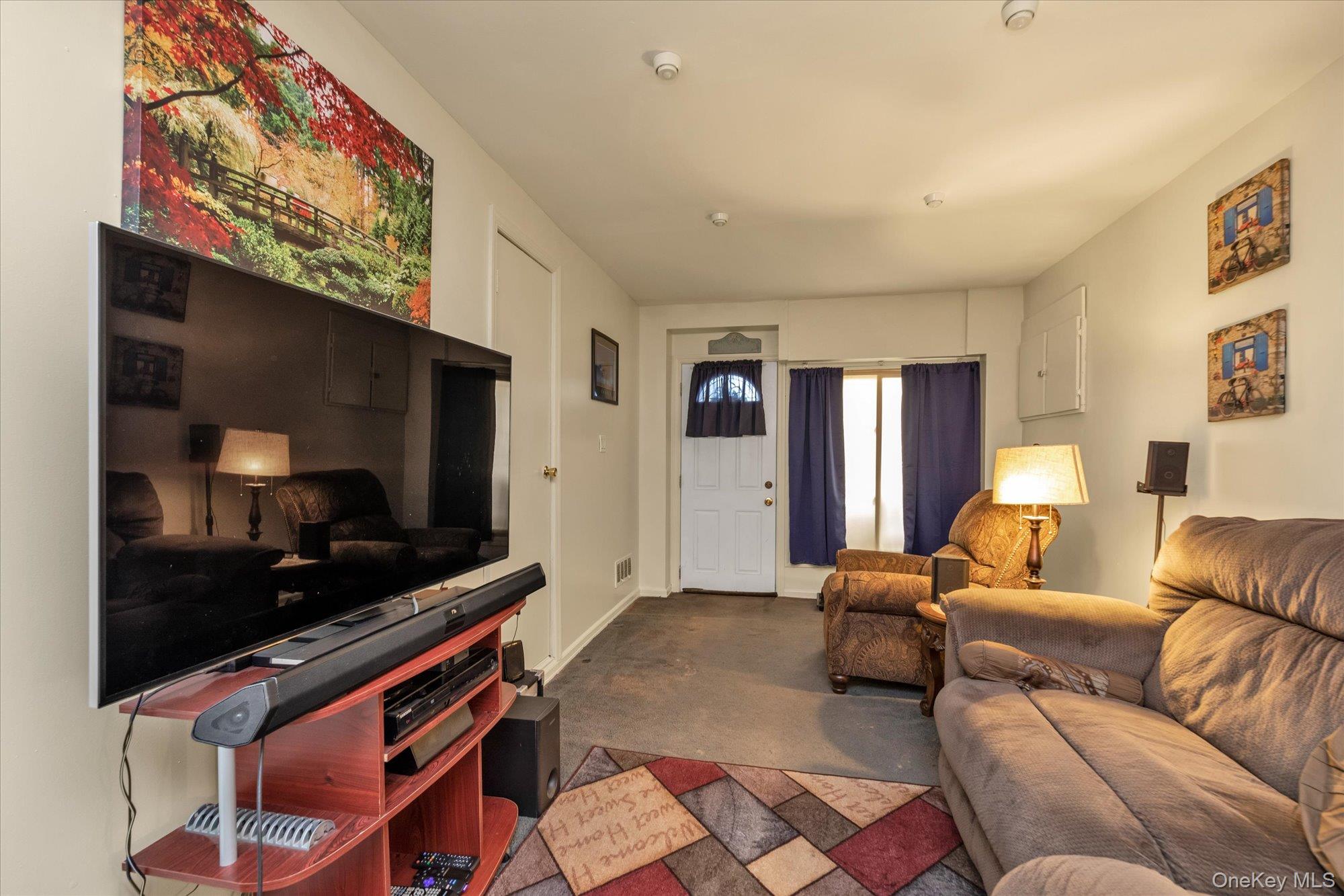 2301 Camp Road Queens, NY 11691 - Photo 13 of 23 a living room with furniture and a flat screen tv