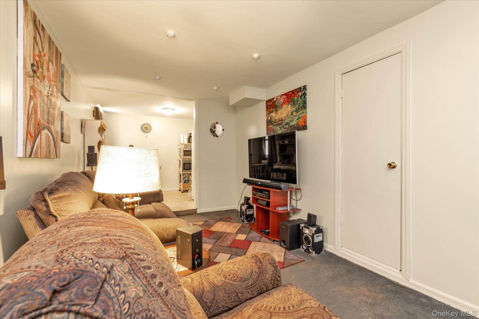 2301 Camp Road Queens, NY 11691 - Photo 14 of 23 a bedroom with a bed and a flat screen tv