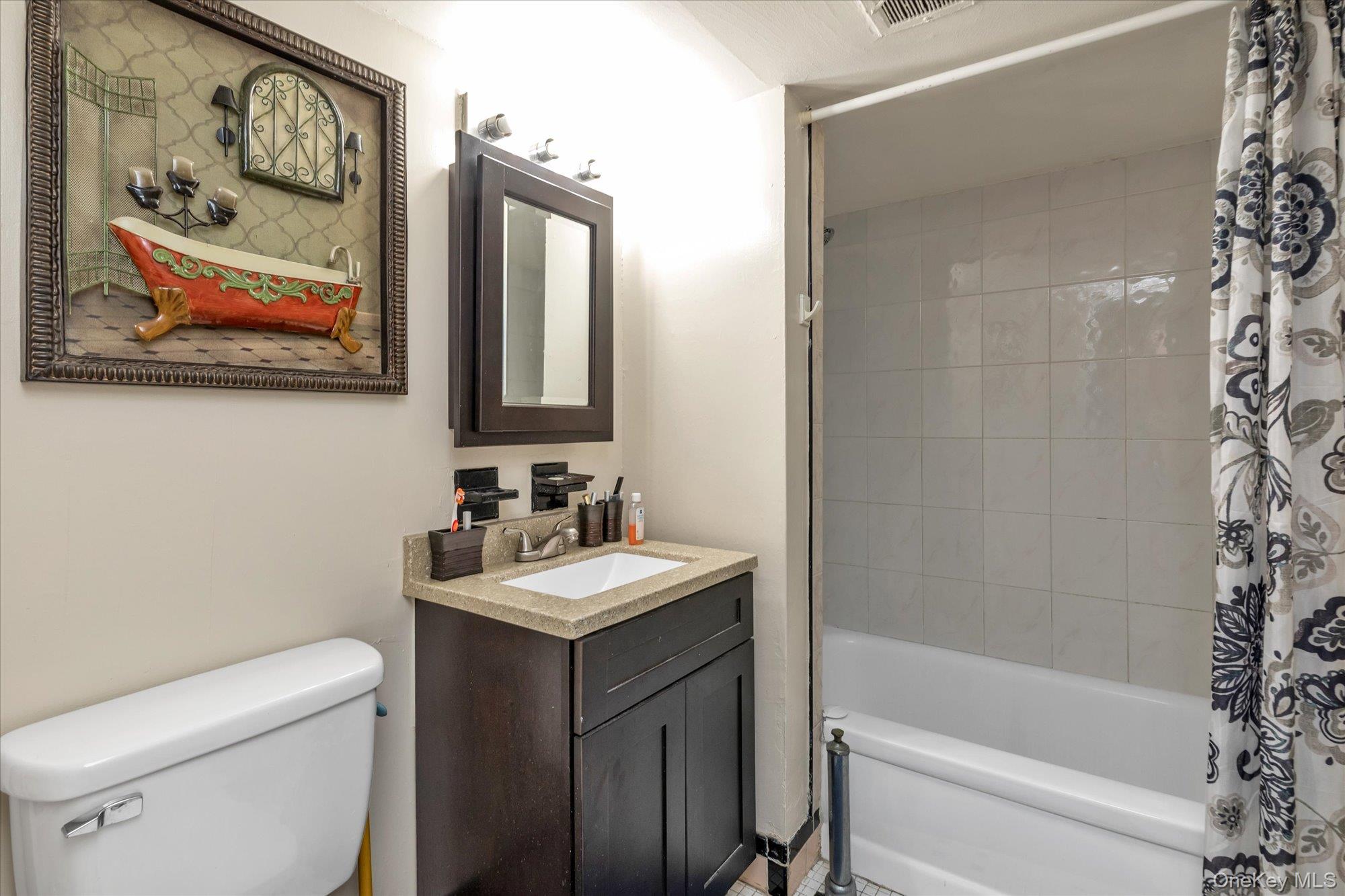 2301 Camp Road Queens, NY 11691 - Photo 20 of 23 a bathroom with a sink a toilet and shower