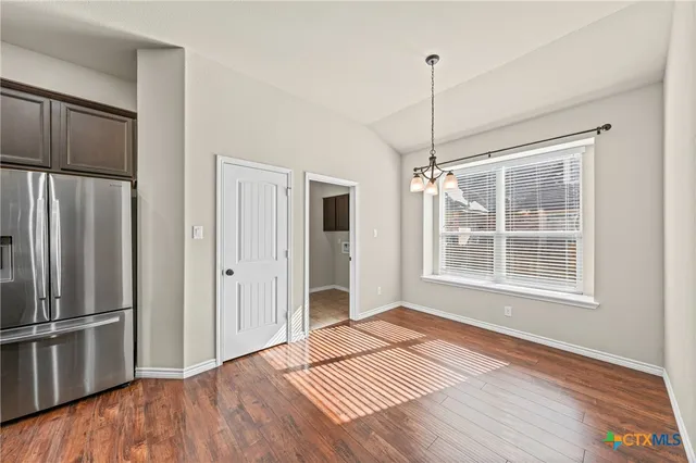 an aerial view of a house with a swimming pool