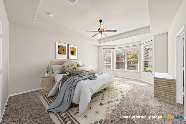 a bed room with a bed and a window