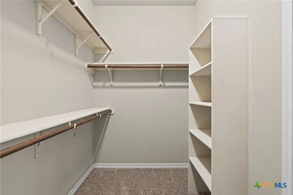 a view of an empty walk in closet