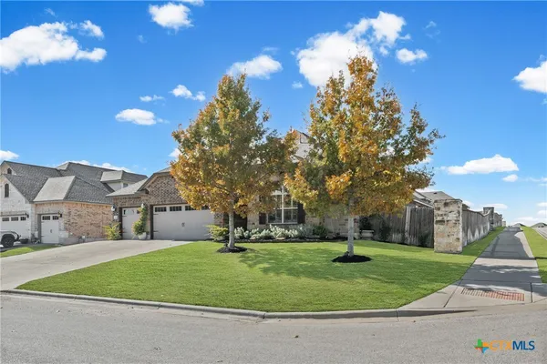 a house view with a garden space