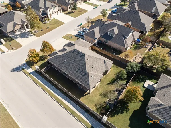 an aerial view of a house with a swimming pool