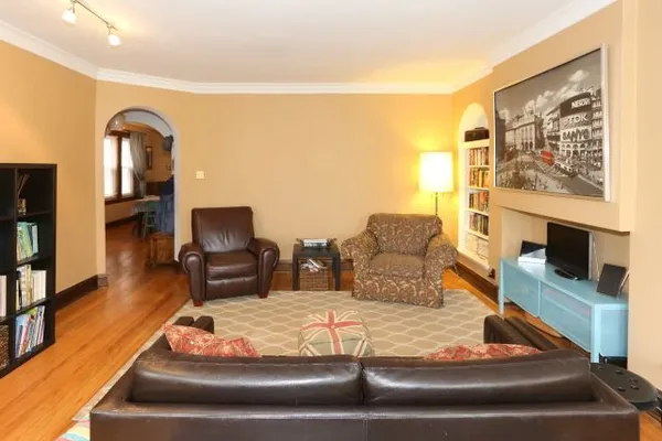 a living room with furniture and a flat screen tv
