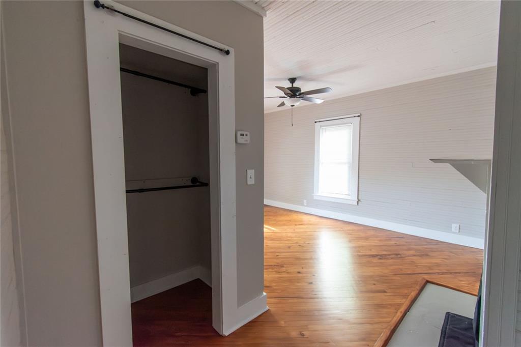 702 Radford Street Monroe, GA 30655 - Photo 34 of 49 a view of empty room with wooden floor and fan
