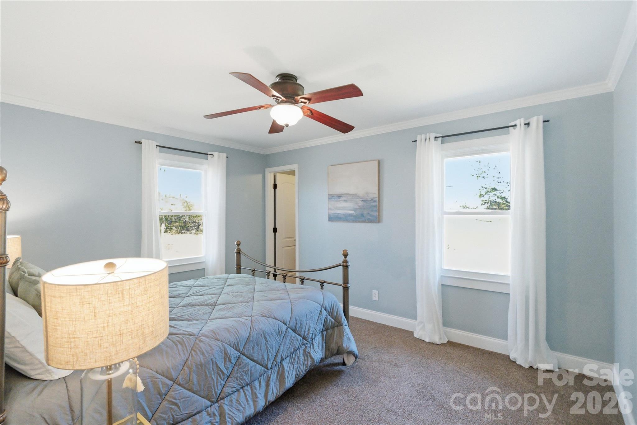 2291 Hicklin Bridge Road Edgemoor, SC 29712 - Photo 12 of 42 a bedroom with a bed and a chandelier