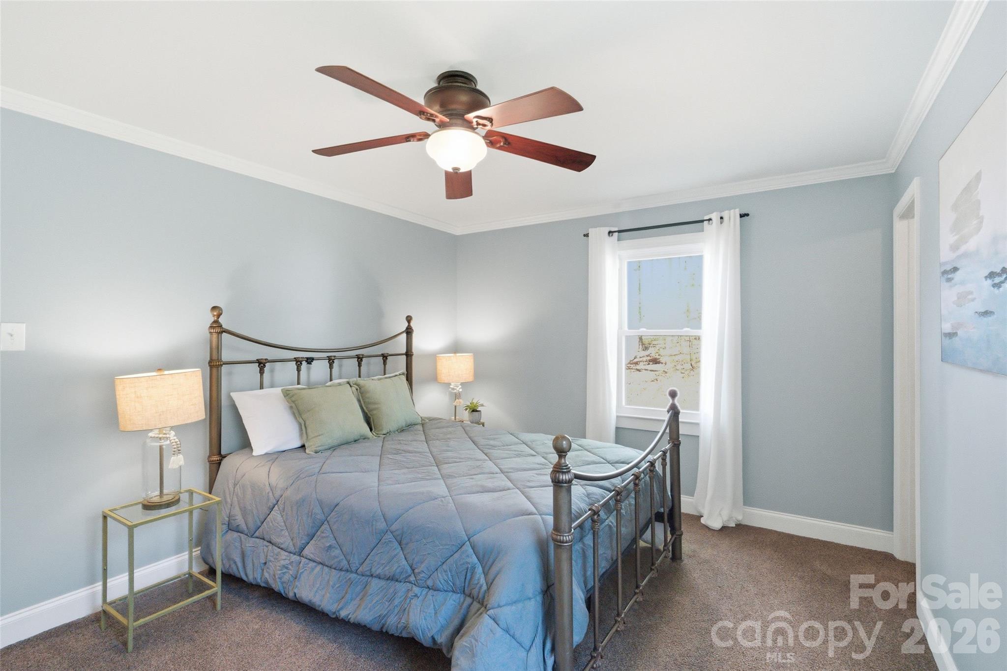 2291 Hicklin Bridge Road Edgemoor, SC 29712 - Photo 13 of 42 a bedroom with a large bed and a chandelier