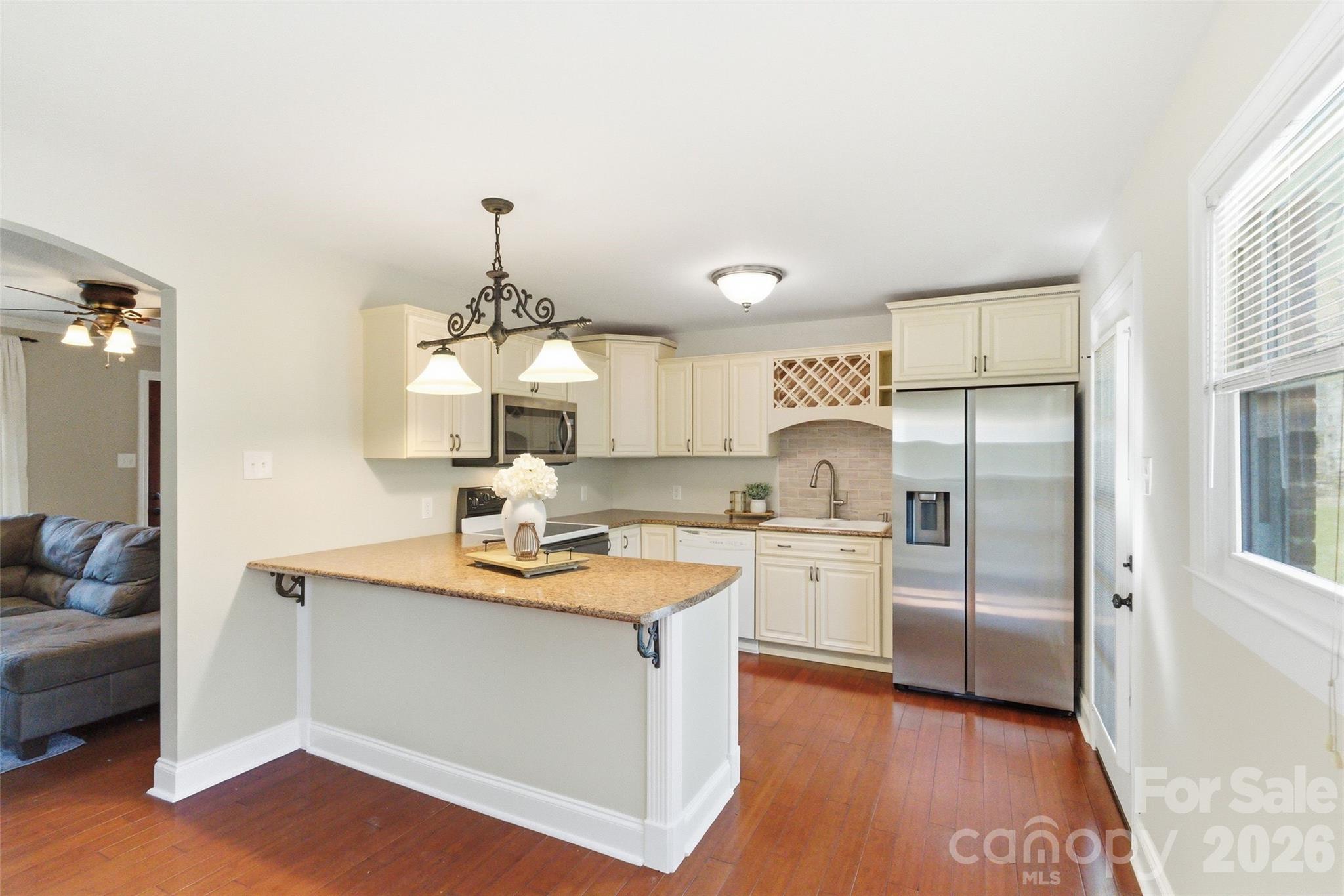 2291 Hicklin Bridge Road Edgemoor, SC 29712 - Photo 16 of 42 a kitchen with a refrigerator sink and cabinets