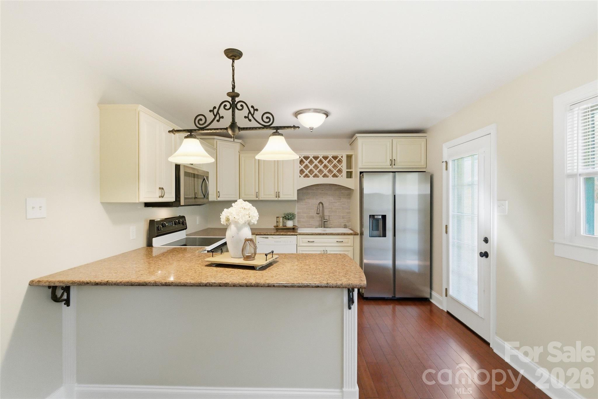 2291 Hicklin Bridge Road Edgemoor, SC 29712 - Photo 17 of 42 a kitchen with stainless steel appliances granite countertop a sink refrigerator and cabinets