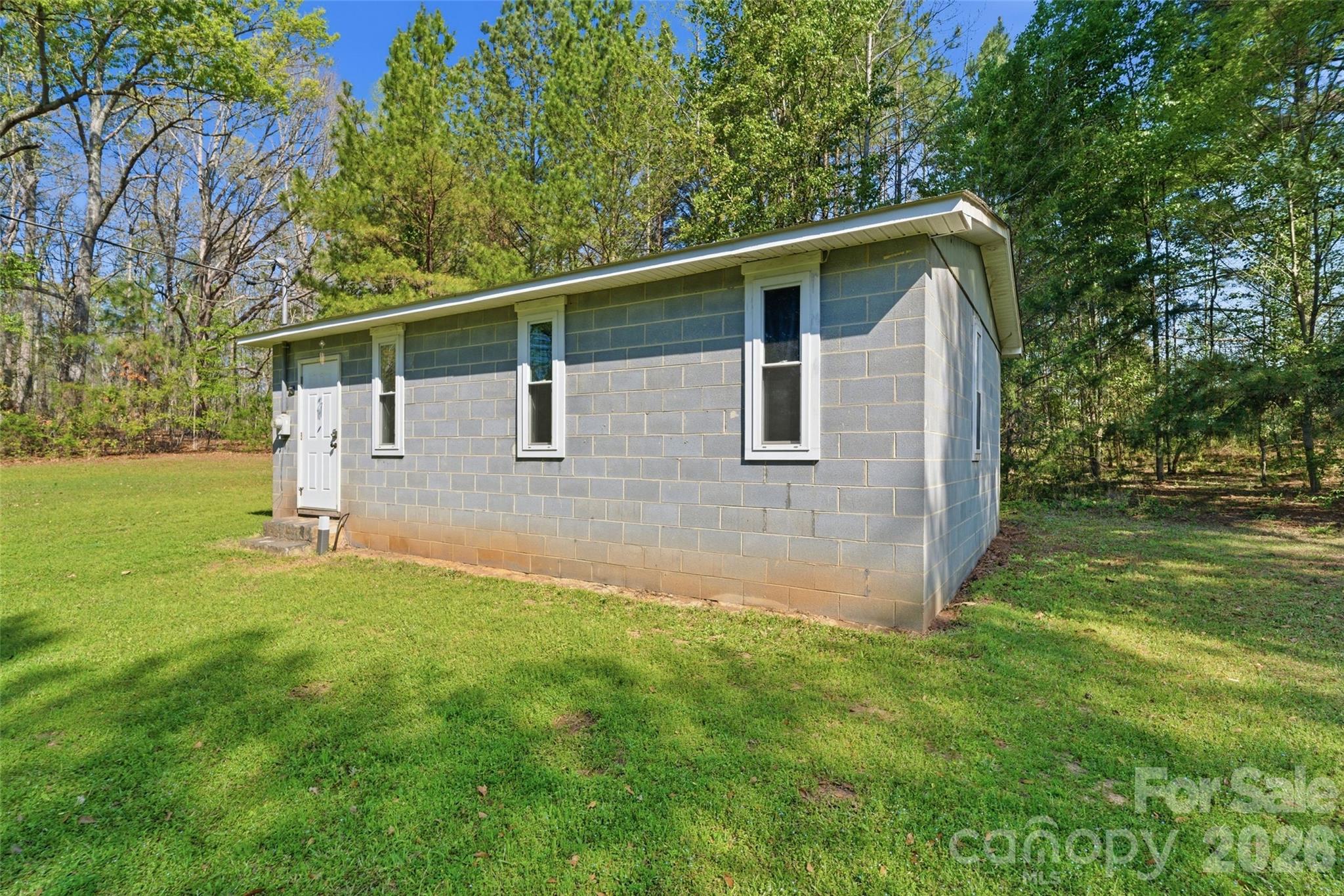 2291 Hicklin Bridge Road Edgemoor, SC 29712 - Photo 26 of 42 a front view of house with yard and trees