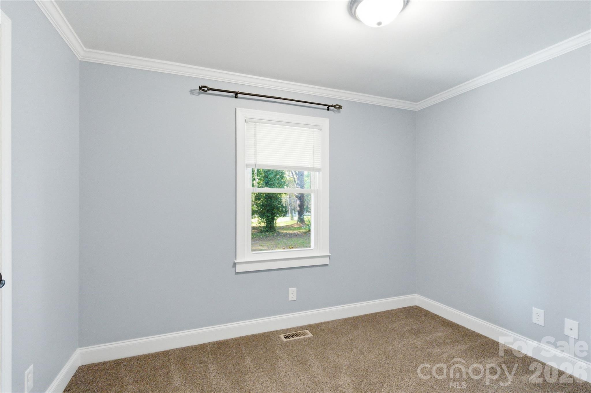 2291 Hicklin Bridge Road Edgemoor, SC 29712 - Photo 6 of 42 a view of an empty room with a window