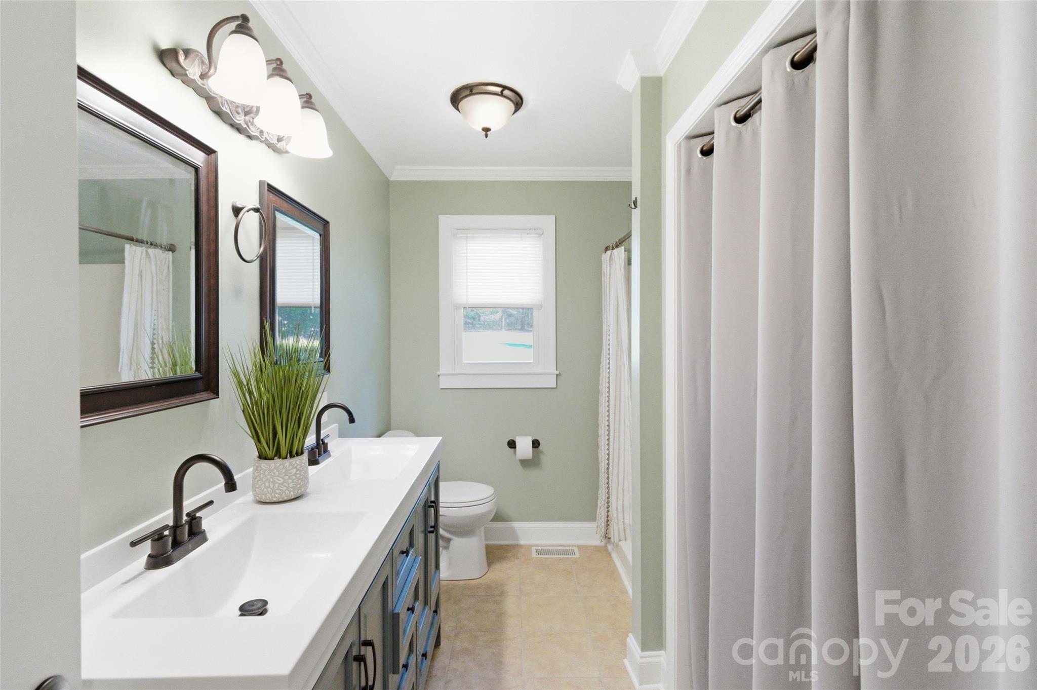 2291 Hicklin Bridge Road Edgemoor, SC 29712 - Photo 8 of 42 a bathroom with double vanity sink a mirror and a shower
