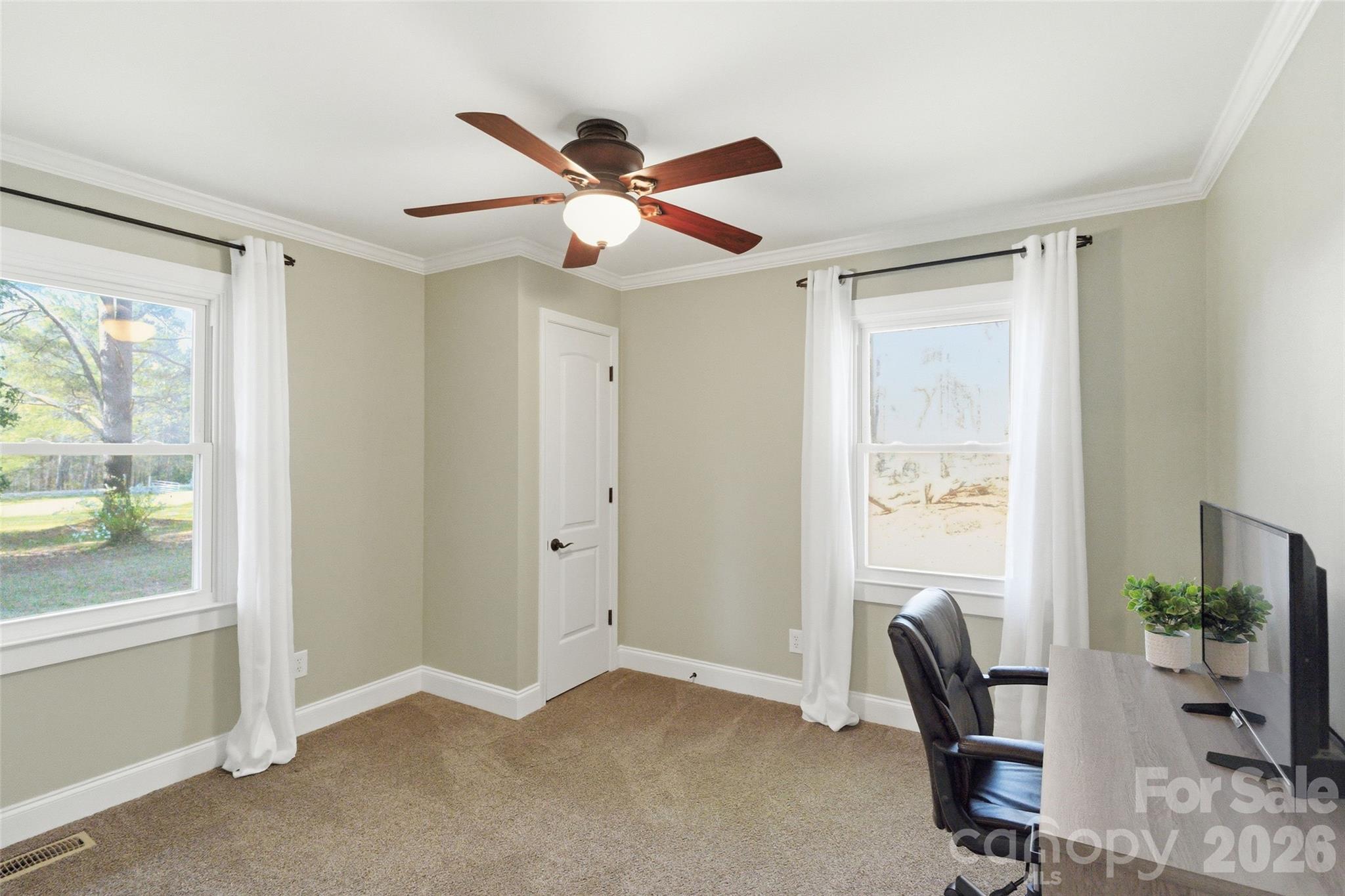 2291 Hicklin Bridge Road Edgemoor, SC 29712 - Photo 10 of 42 a view of a workspace with furniture and a window