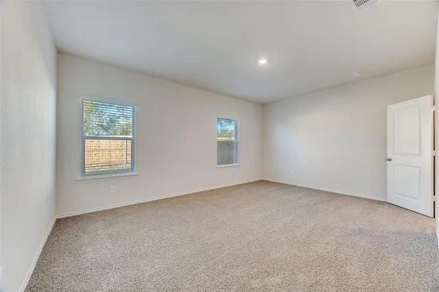 a kitchen with stainless steel appliances a microwave a stove a sink a refrigerator and cabinets