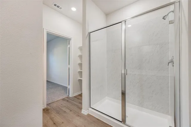 a bathroom with a double vanity sink and mirror