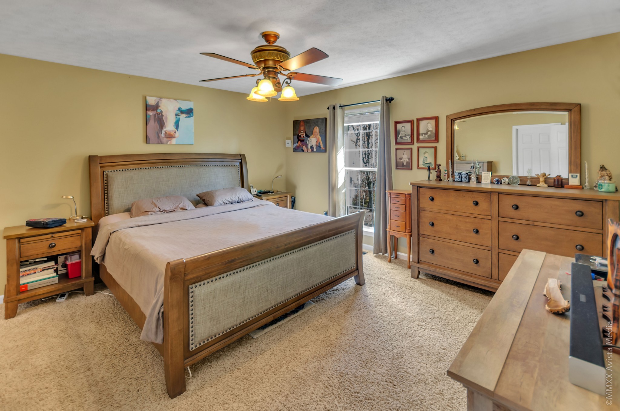267 Ernest Cates Road Bethpage, TN 37022 - Photo 11 of 30 a bedroom with a bed and a chandelier