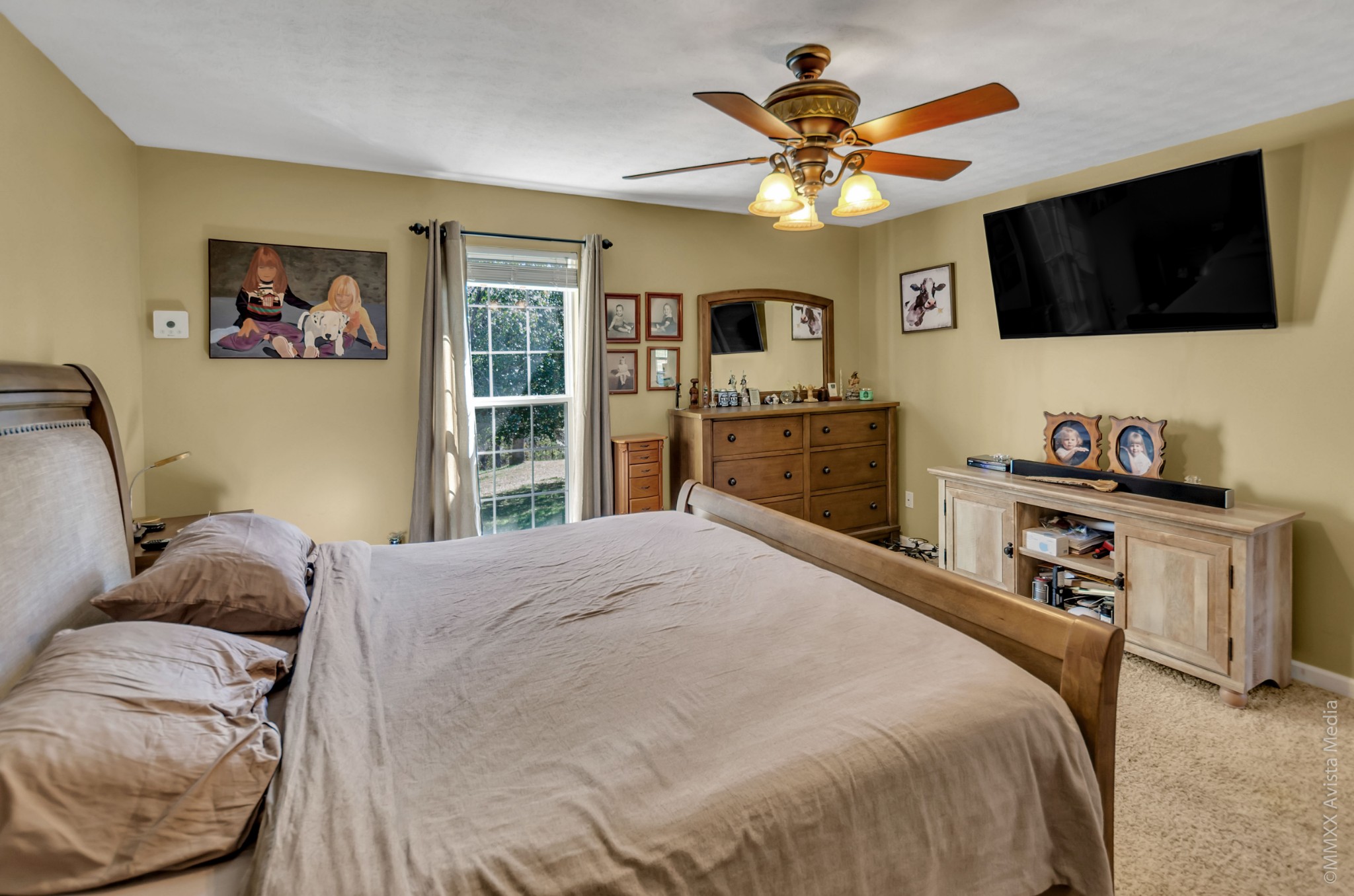 267 Ernest Cates Road Bethpage, TN 37022 - Photo 12 of 30 a bedroom with a bed and a flat screen tv