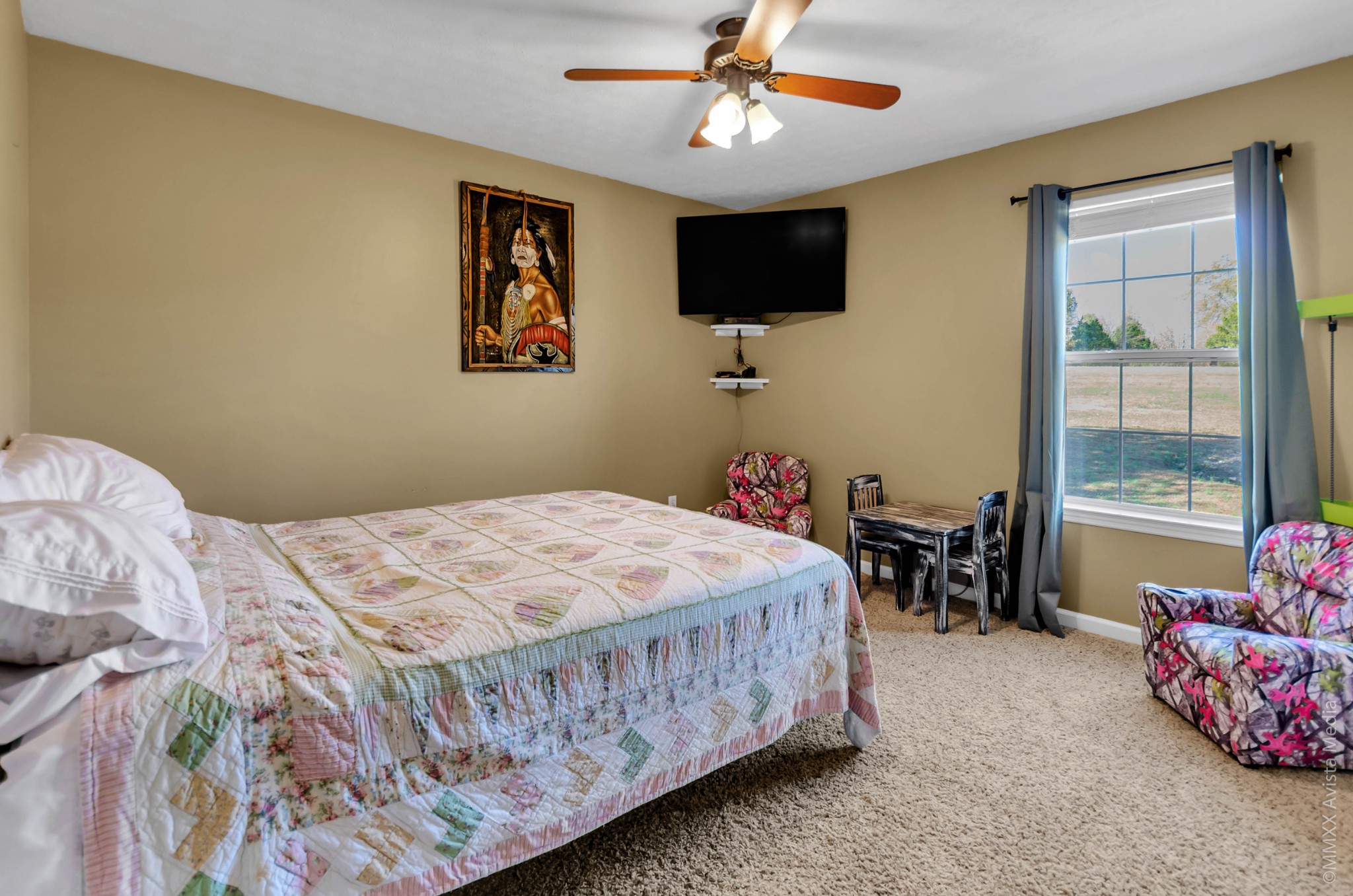 267 Ernest Cates Road Bethpage, TN 37022 - Photo 15 of 30 a bedroom with a bed and a flat screen tv