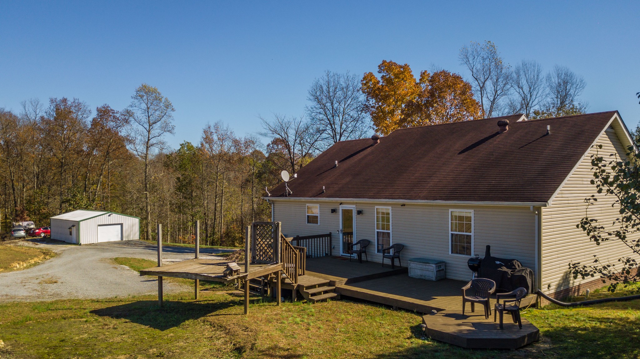 267 Ernest Cates Road Bethpage, TN 37022 - Photo 24 of 30 a view of a house with backyard water fountain and sitting area