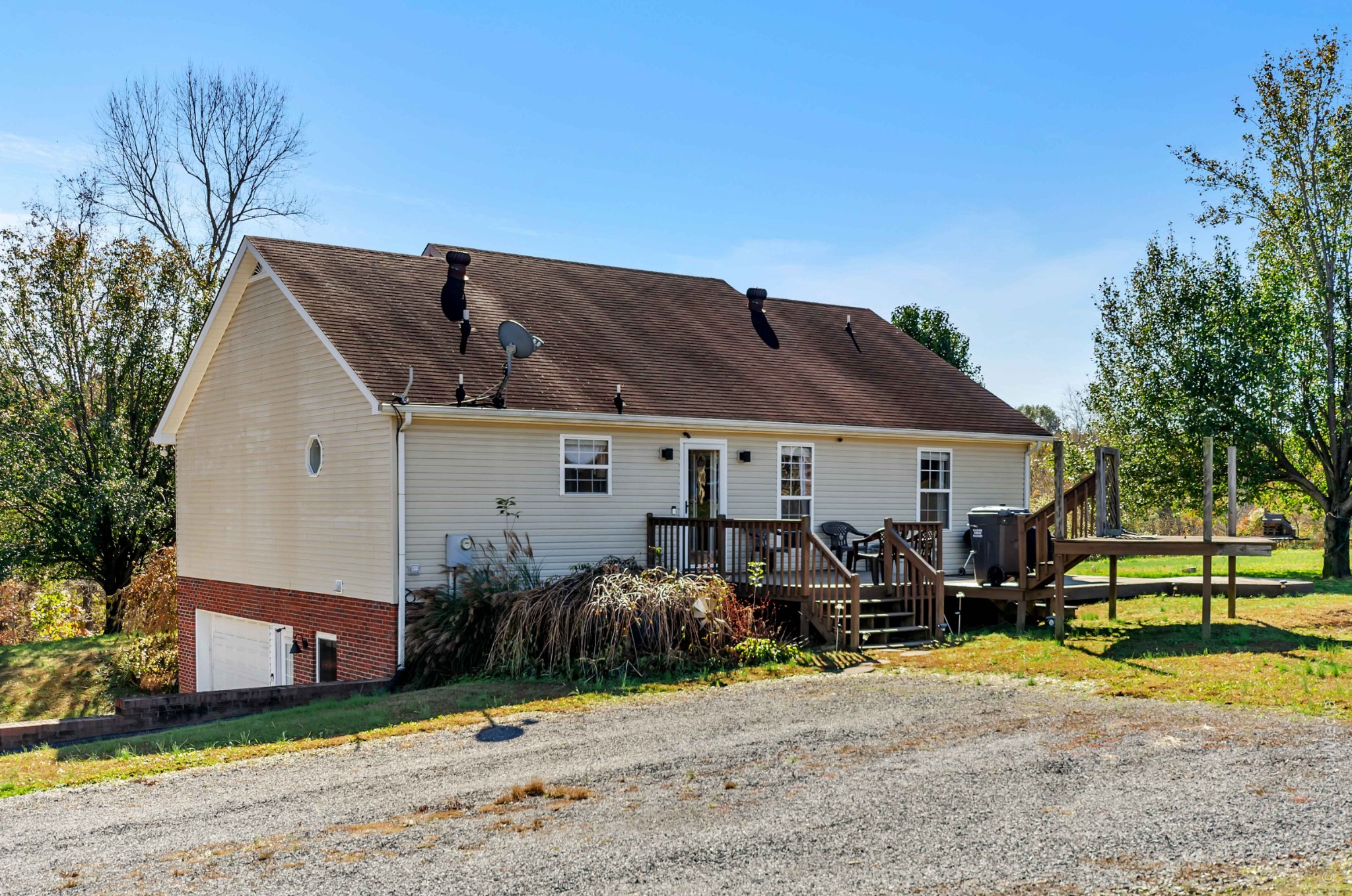 267 Ernest Cates Road Bethpage, TN 37022 - Photo 25 of 30 a front view of a house with a yard and potted plants