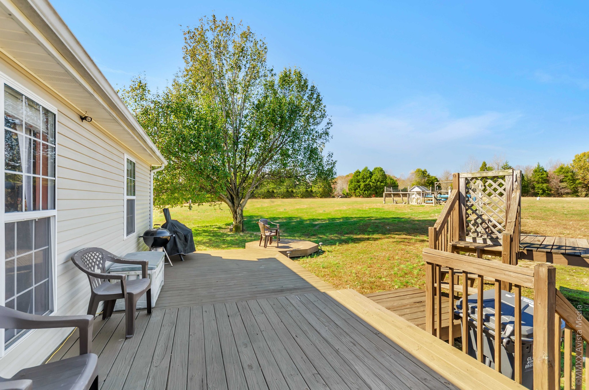 267 Ernest Cates Road Bethpage, TN 37022 - Photo 26 of 30 a view of a patio with chairs and table on wooden deck