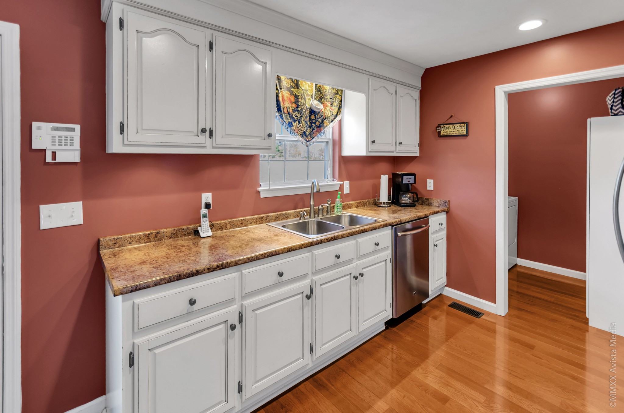 267 Ernest Cates Road Bethpage, TN 37022 - Photo 8 of 30 a kitchen with granite countertop white cabinets white appliances and a sink