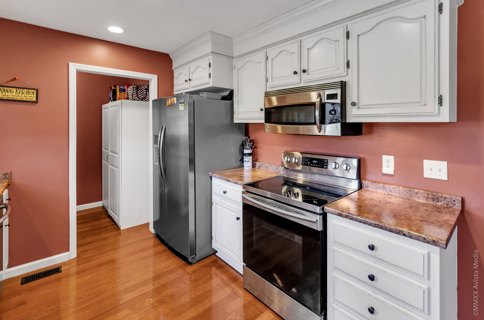 267 Ernest Cates Road Bethpage, TN 37022 - Photo 9 of 30 a kitchen with stainless steel appliances granite countertop a stove a refrigerator and a microwave