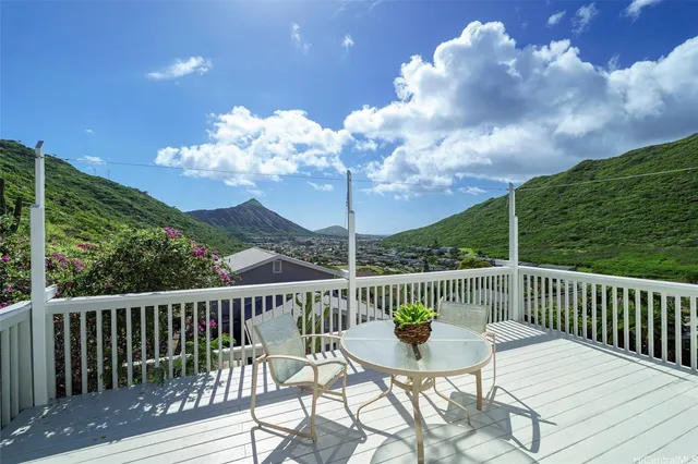 a view of a balcony with wooden floor