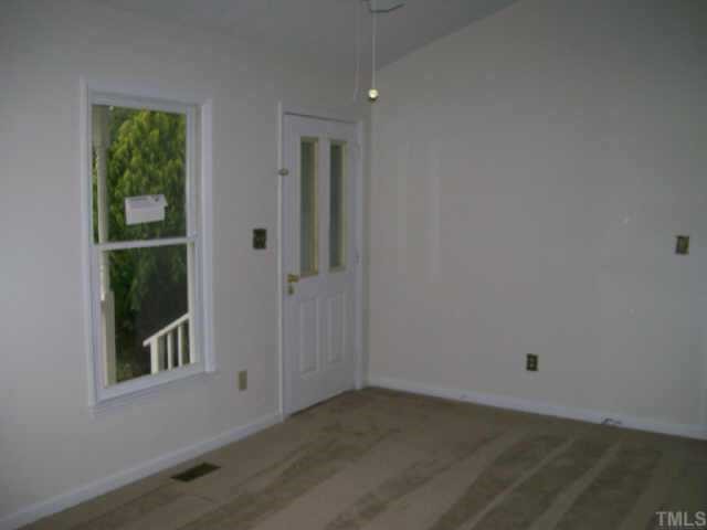 4308 Candle Court Raleigh, NC 27616 - Photo 2 of 8 an empty room with a window