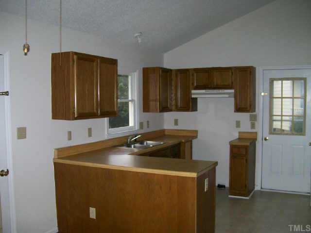 4308 Candle Court Raleigh, NC 27616 - Photo 3 of 8 a utility room with sink dryer and washer