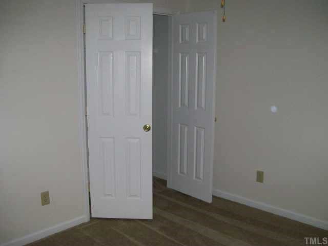 4308 Candle Court Raleigh, NC 27616 - Photo 6 of 8 a view of an empty room