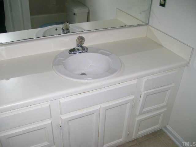 4308 Candle Court Raleigh, NC 27616 - Photo 8 of 8 a bathroom with a sink and vanity