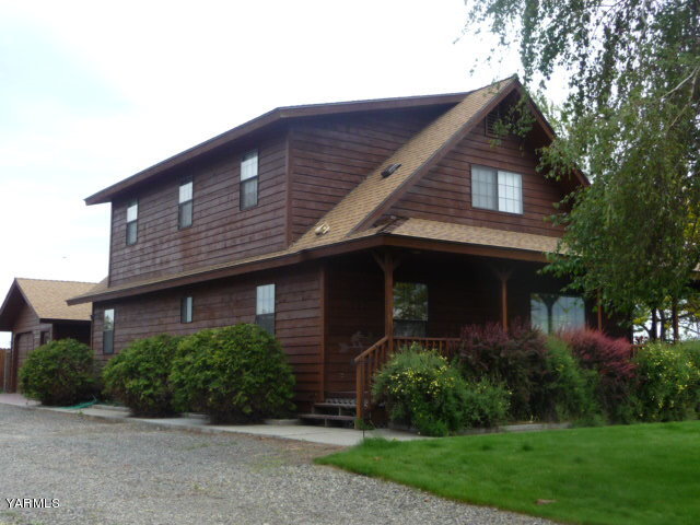 421 Blaine Road Granger, WA 98932 - Photo 2 of 23 a front view of a house with a yard