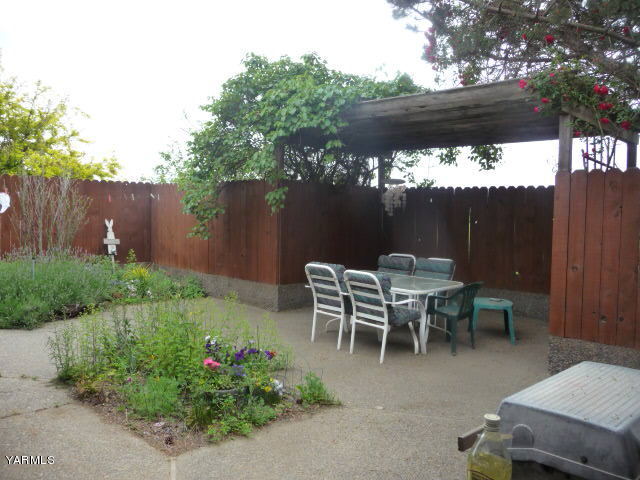 421 Blaine Road Granger, WA 98932 - Photo 17 of 23 a view of a tables and chairs in back yard of a house
