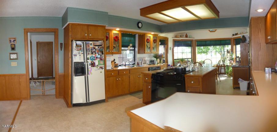 421 Blaine Road Granger, WA 98932 - Photo 7 of 23 a kitchen with a sink appliances and cabinets