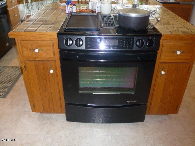 421 Blaine Road Granger, WA 98932 - Photo 8 of 23 a stove top oven sitting inside of a kitchen