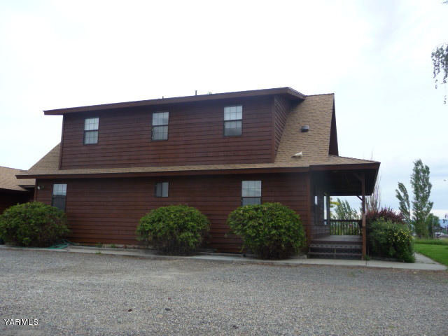 421 Blaine Road Granger, WA 98932 - Photo 10 of 23 a front view of a house with garage