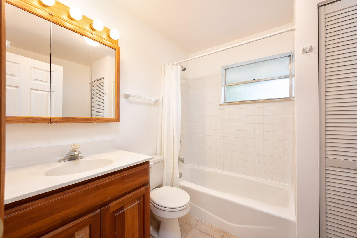 27346 Martinique Lane Summerland Key, FL 33042 - Photo 15 of 33 a bathroom with a sink a toilet and a bathtub