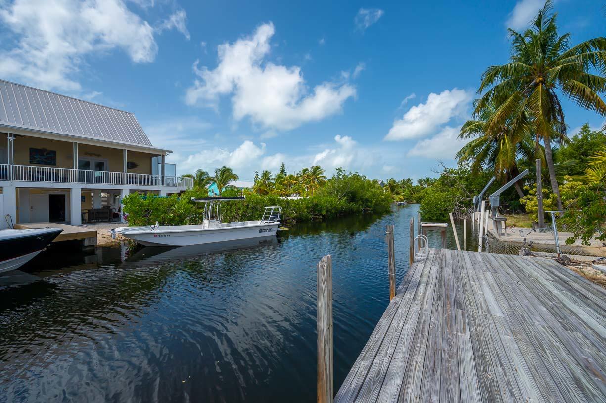 27346 Martinique Lane Summerland Key, FL 33042 - Photo 17 of 33 a view of a house with pool and lake view